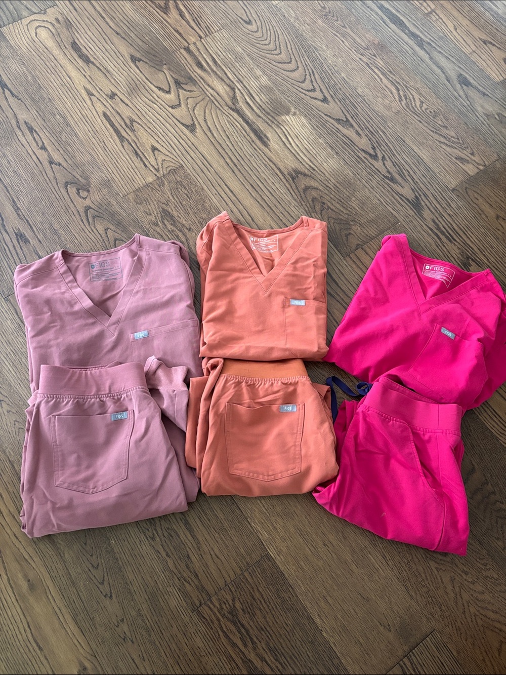 Figs Women's Scrub Sets in Pink, Coral & Hot Pink. $170.00 for all 3.